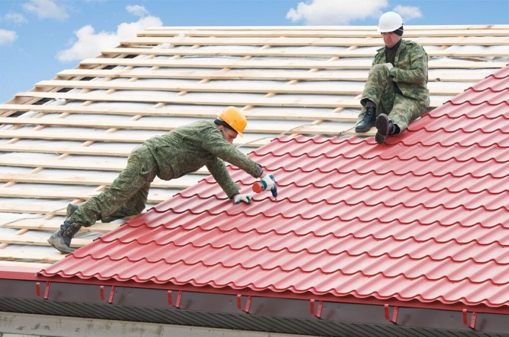 Technicians applying waterproofing coating on flat roof surface in New York City.