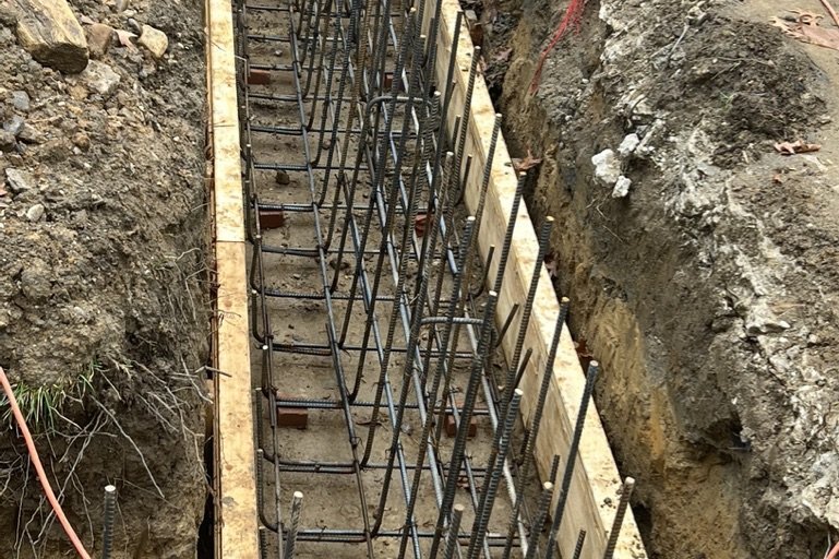 Newly poured concrete floor slab in a waterproofed NYC basement